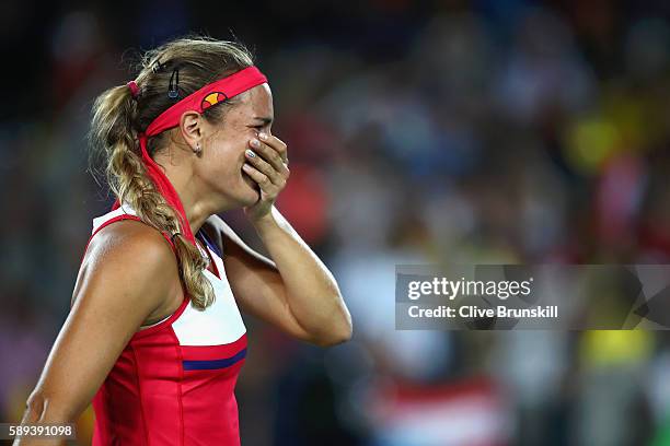 Monica Puig of Puerto Rico reacts after defeating Angelique Kerber of Germany in the Women's Singles Gold Medal Match on Day 8 of the Rio 2016...