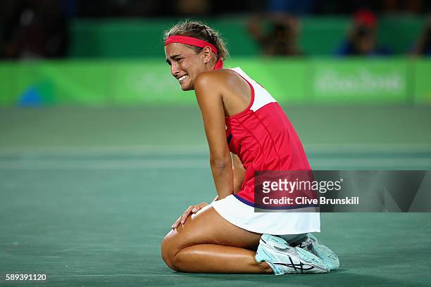 Monica Puig of Puerto Rico reacts after defeating Angelique Kerber of Germany in the Women's Singles Gold Medal Match on Day 8 of the Rio 2016...