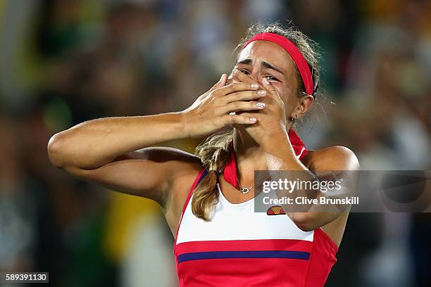 Monica Puig of Puerto Rico reacts after defeating Angelique Kerber of Germany in the Women's Singles Gold Medal Match on Day 8 of the Rio 2016...