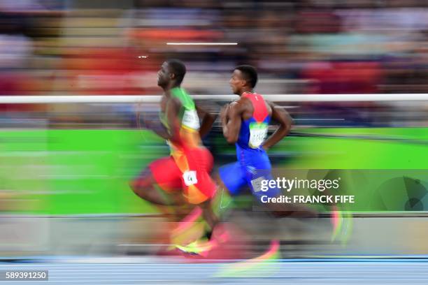 Costa Rica's Nery Brenes and Grenada's Kirani James compete in the Men's 400m Semifinal during the athletics event at the Rio 2016 Olympic Games at...