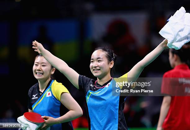 Ai Fukuhara and Mima Ito of Japan celebrate after winning match point against Austria during the Table Tennis Women's Team Round Quarter Final...