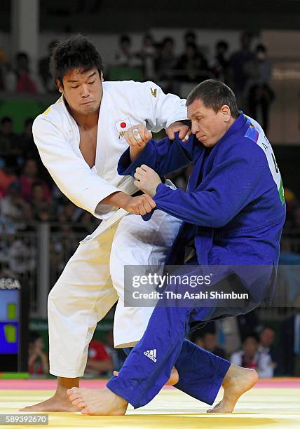 Ryunosuke Haga of Japan and Artem Bloshenko of Ukraine compete in the Men's -100kg bronze medal B contest on Day 6 of the 2016 Rio Olympics at...