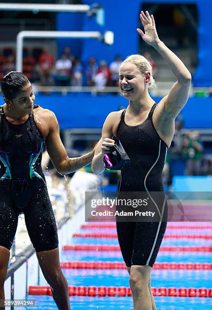 Etiene Medeiros of Brazil congratulates Pernille Blume of Denmark on winning gold in the Women's 50m Freestyle Final on Day 8 of the Rio 2016 Olympic...