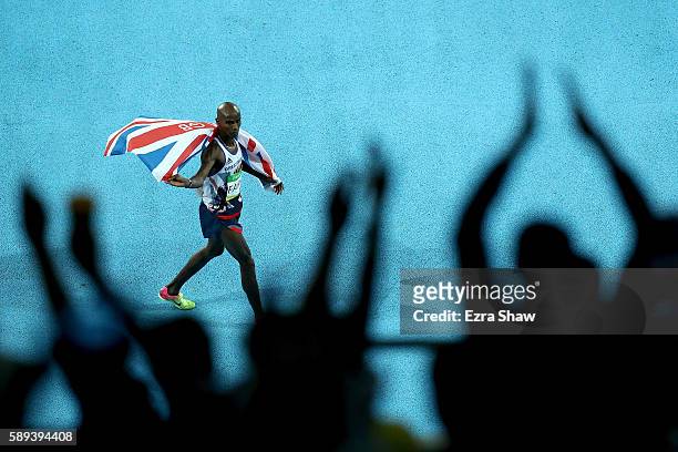 Mohamed Farah of Great Britain celebrates after winning the Men's 10,000m on Day 8 of the Rio 2016 Olympic Games at the Olympic Stadium on August 13,...