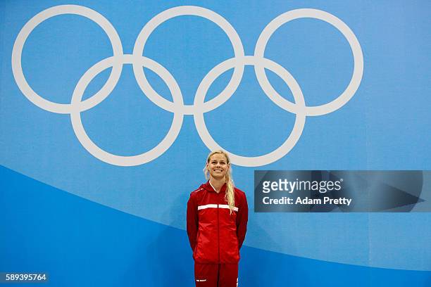 Gold medalist Pernille Blume of Denmark celebrates on the podium during the medal ceremony for the Women's 50m Freestyle Final on Day 8 of the Rio...