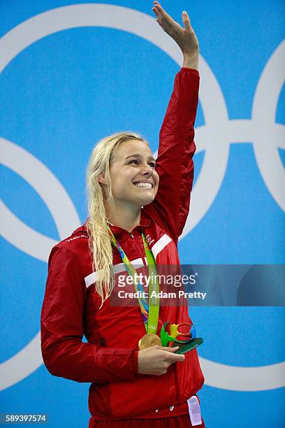 Gold medalist Pernille Blume of Denmark celebrates on the podium during the medal ceremony for the Women's 50m Freestyle Final on Day 8 of the Rio...