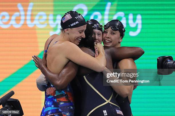 Team United States celebrate winning gold in the Women's 4 x 100m Medley Relay Final on Day 8 of the Rio 2016 Olympic Games at the Olympic Aquatics...