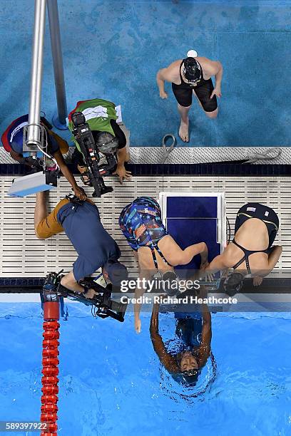 Team United States celebrate winning gold in the Women's 4 x 100m Medley Relay Final on Day 8 of the Rio 2016 Olympic Games at the Olympic Aquatics...