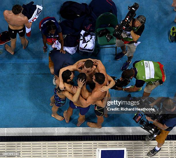 Nathan Adrian, Ryan Murphy, Michael Phelps and Cody Miller of the United States celebrate winning gold in the Men's 4 x 100m Medley Relay Final on...