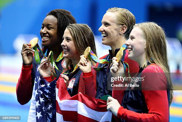 Kathleen Baker, Lilly King, Dana Vollmer, Simone Manuel of the United States pose during the medal ceremony for the Women's 4 x 100m Medley Relay...