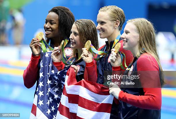 Kathleen Baker, Lilly King, Dana Vollmer, Simone Manuel of the United States pose during the medal ceremony for the Women's 4 x 100m Medley Relay...