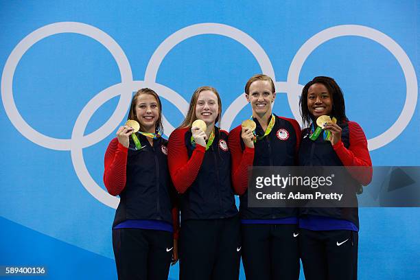 Gold medalists Kathleen Baker, Lilly King, Dana Vollmer, Simone Manuel of the United States celebrate on the podium during the medal ceremony for the...