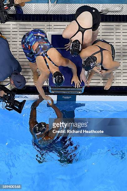 Team United States celebrate winning gold in the Women's 4 x 100m Medley Relay Final on Day 8 of the Rio 2016 Olympic Games at the Olympic Aquatics...