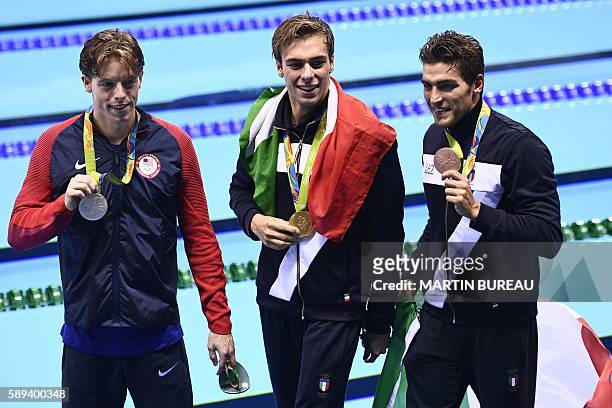 Italy's gold medallist Gregorio Paltrinieri, USA's silver medallist Connor Jaeger and Italy's bronze Gabriele Detti pose with their medals after the...