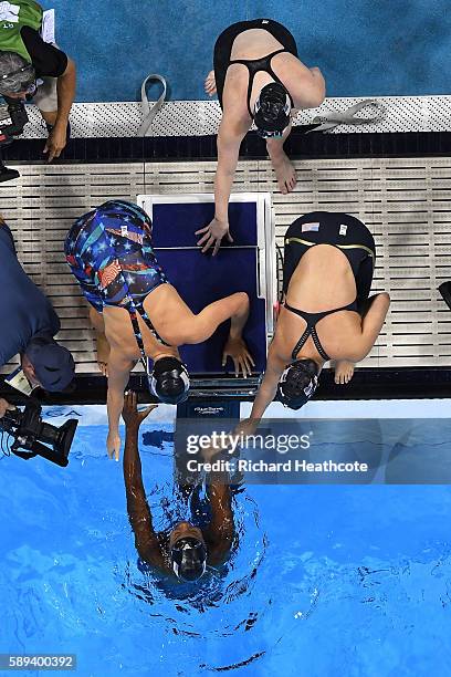 Team United States celebrate winning gold in the Women's 4 x 100m Medley Relay Final on Day 8 of the Rio 2016 Olympic Games at the Olympic Aquatics...