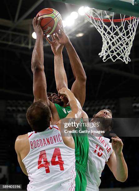 Ike Diogu of Nigeria battles Bojan Bogdanovic and Miro Bilan of Croatia for a rebound during the preliminary round game at the Rio 2016 Olympic Games...