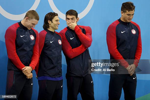 Gold medalists Ryan Murphy, Cody Miller, Michael Phelps and Nathan Adrian of the United States pose on the podium during the medal ceremony for the...