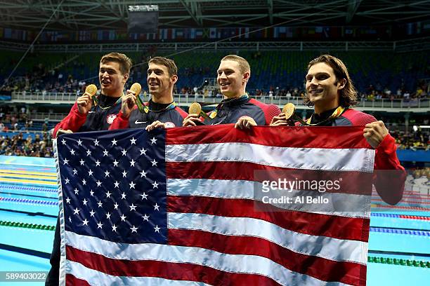 Gold medalists Nathan Adrian, Michael Phelps, Ryan Murphy and Cody Miller of the United States pose during the medal ceremony for the Men's 4 x 100m...