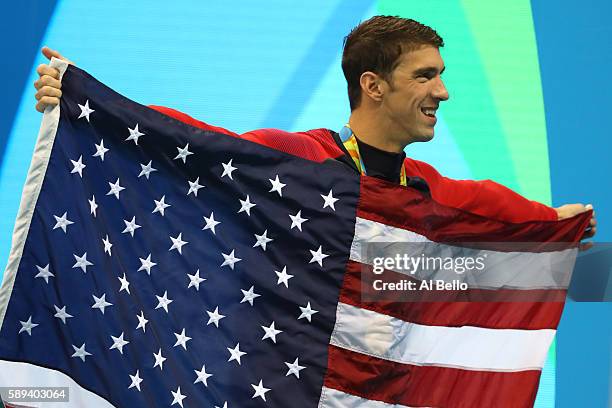 Gold medalist Michael Phelps of the United States poses during the medal ceremony for the Men's 4 x 100m Medley Relay Final on Day 8 of the Rio 2016...
