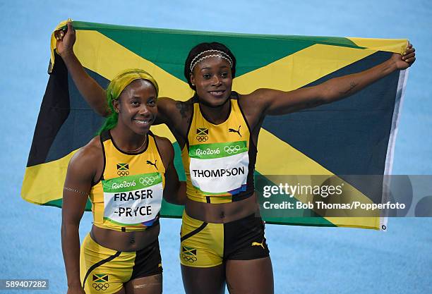 Elaine Thompson of Jamaica celebrates winning the Women's 100m Final with Shelly-Ann Fraser-Pryce of Jamaica on Day 8 of the Rio 2016 Olympic Games...