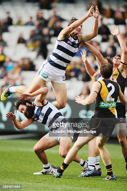 Shane Kersten of the Cats crashes nto teammate Jimmy Bartel during the round 21 AFL match between the Richmond Tigers and the Geelong Cats at...