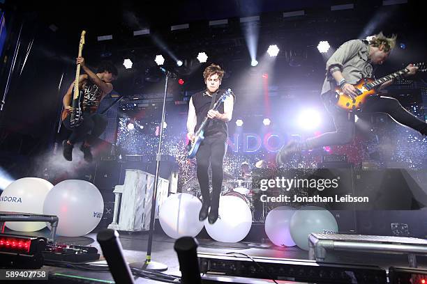 Recording artists Calum Hood, Luke Hemmings, Ashton Irwin, and Michael Clifford of 5 Seconds of Summer perform onstage during Pandora Summer Crush at...