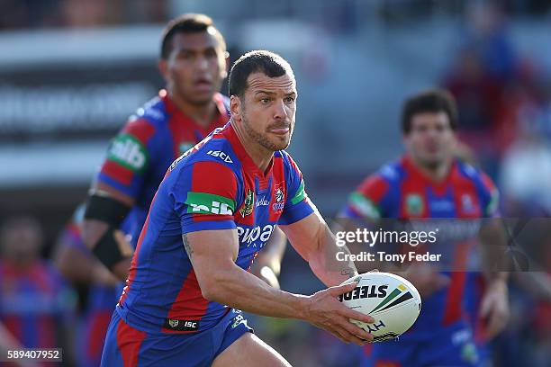 Jarrod Mullen of the Knights runs the ball during the round 23 NRL match between the Newcastle Knights and the Penrith Panthers at Hunter Stadium on...