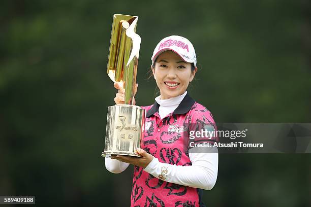 Ritsuko Ryu of Japan poses with the trophy after winning the NEC Karuizawa 72 Golf Tournament 2016 at the Karuizawa 72 Golf North Course on August...