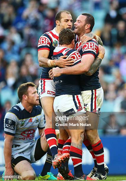 Boyd Cordner of the Roosters celebrates scoring a try during the round 23 NRL match between the Sydney Roosters and the North Queensland Cowboys at...