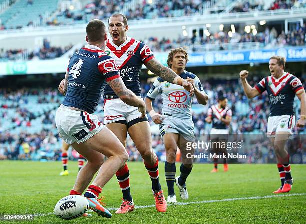 Shaun Kenny-Dowall of the Roosters celebrates his try with team mate Blake Ferguson during the round 23 NRL match between the Sydney Roosters and the...