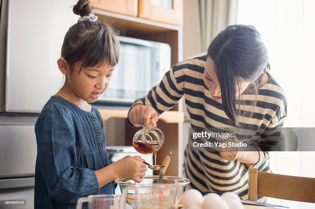 Mother and daughter making  cookies together