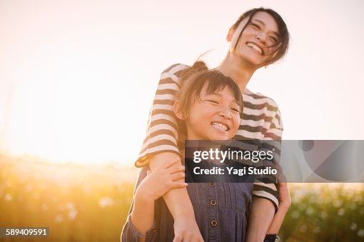 Mother and daughter are in the cosmos field