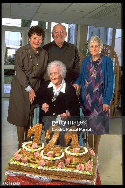 Jeanne Calment, the world's oldest person celebrating a little earlier her 121st anniversary with her great great cousin Gilberte Mery and her...