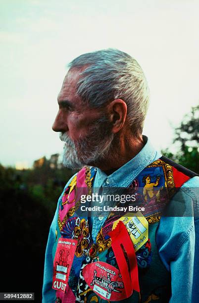 View of Timothy Leary in profile wearing colorful vest adorned with concert backstage passes at his home in February 1994 in Beverly Hills,...