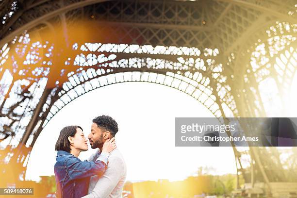 romantic couple eiffel tower paris france - sassy paris stock pictures, royalty-free photos & images