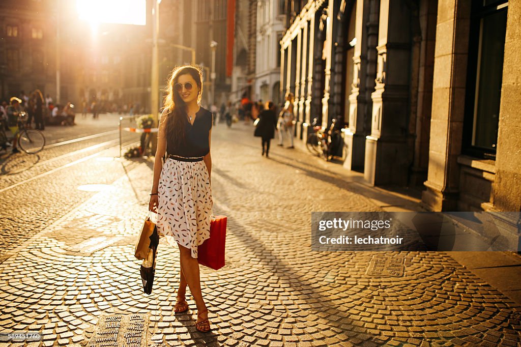 Young woman walking and shopping in Amsterdam