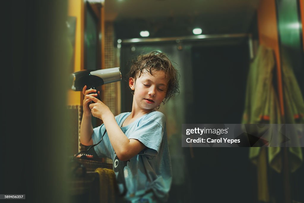Child drying his hair
