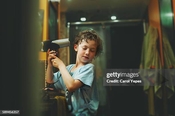 child drying his hair - hair dryer foto e immagini stock