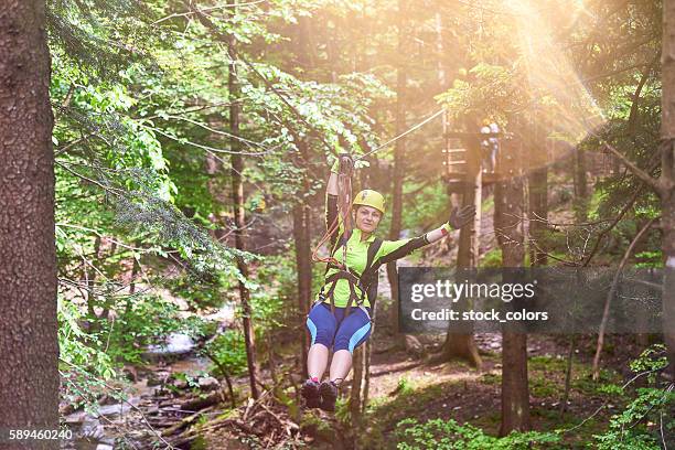 fun time on tyrolean traverse - safety harness military stock pictures, royalty-free photos & images