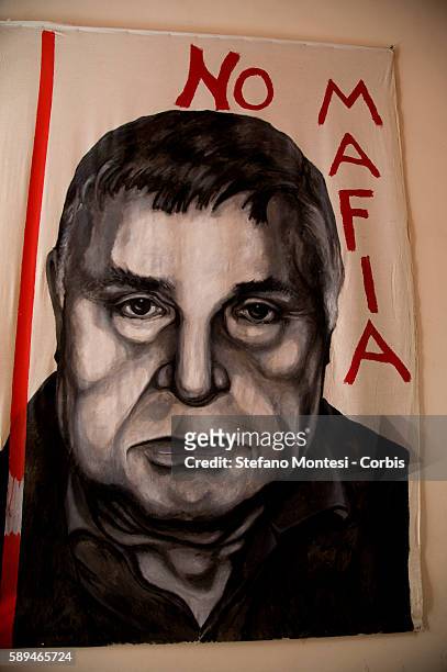 Portrait of the Mafia boss Salvatore Riina is displayed at the entrance of the International Centre for Documentation on the Mafia and the Anti-Mafia...