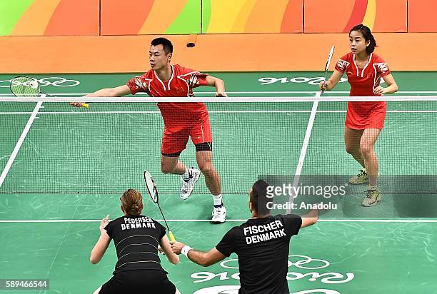 Xu Chen and Ma Jin of China compete against Fischer Nielsen Joachim and Pedersen Christinna of Denmark during the Mixed Doubles Badminton match on...