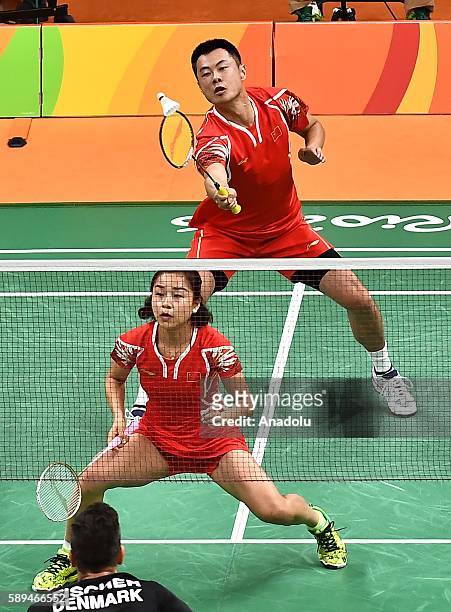 Xu Chen and Ma Jin of China compete against Fischer Nielsen Joachim and Pedersen Christinna of Denmark during the Mixed Doubles Badminton match on...