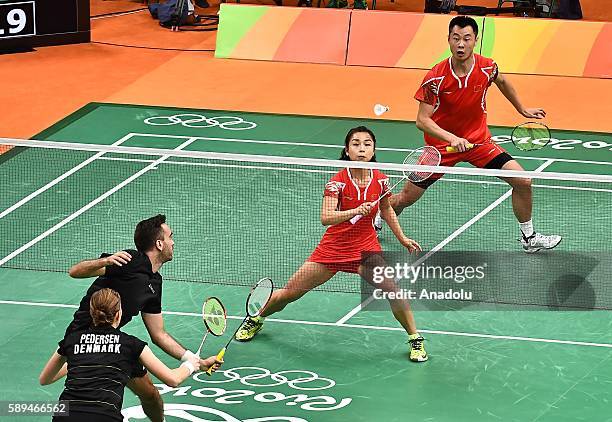 Xu Chen and Ma Jin of China compete against Fischer Nielsen Joachim and Pedersen Christinna of Denmark during the Mixed Doubles Badminton match on...