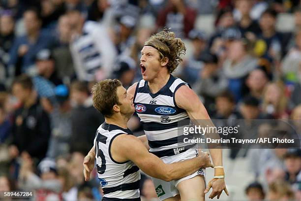 Josh Caddy of the Cats celebrates a goal during the round 21 AFL match between the Richmond Tigers and the Geelong Cats at Melbourne Cricket Ground...
