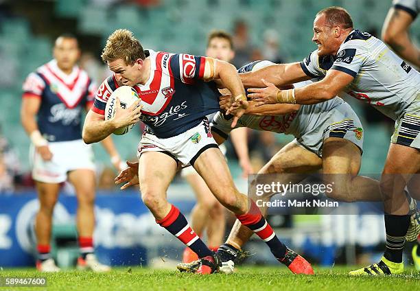 Mitchell Aubusson of the Roosters makes a line break during the round 23 NRL match between the Sydney Roosters and the North Queensland Cowboys at...