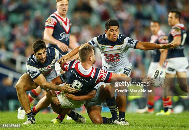 Jared Waerea-Hargreaves of the Roosters offloads during the round 23 NRL match between the Sydney Roosters and the North Queensland Cowboys at...