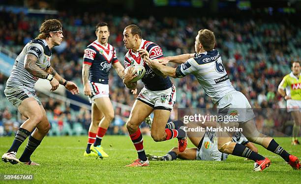 Blake Ferguson of the Roosters runs the ball during the round 23 NRL match between the Sydney Roosters and the North Queensland Cowboys at Allianz...