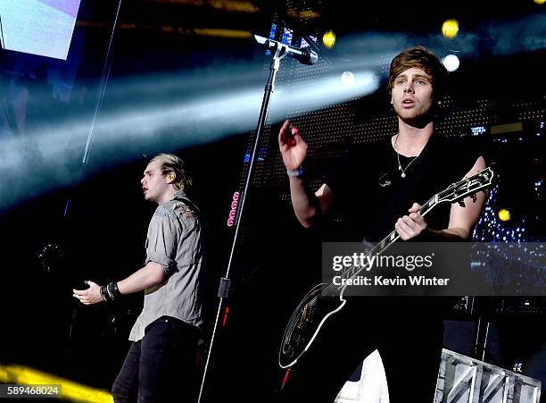 Musicians Michael Clifford and Luke Hemmings of 5 Seconds of Summer perform at the Pandora Summer Crush at L.A. Live on August 13, 2016 in Los...