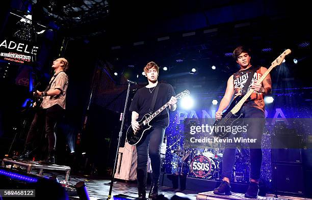 Musicians Michael Clifford, Luke Hemmings and Calum Hood of 5 Seconds of Summer perform at the Pandora Summer Crush at L.A. Live on August 13, 2016...