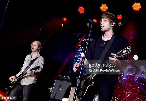 Musicians Michael Clifford and Luke Hemmings of 5 Seconds of Summer perform at the Pandora Summer Crush at L.A. Live on August 13, 2016 in Los...